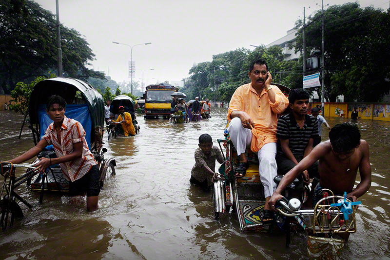 Arambagh, Dhaka, Bangladesh, 2009. After a night of heavy rain, Dhaka experienced widespread  flooding around the city. © Jonas Bendiksen.